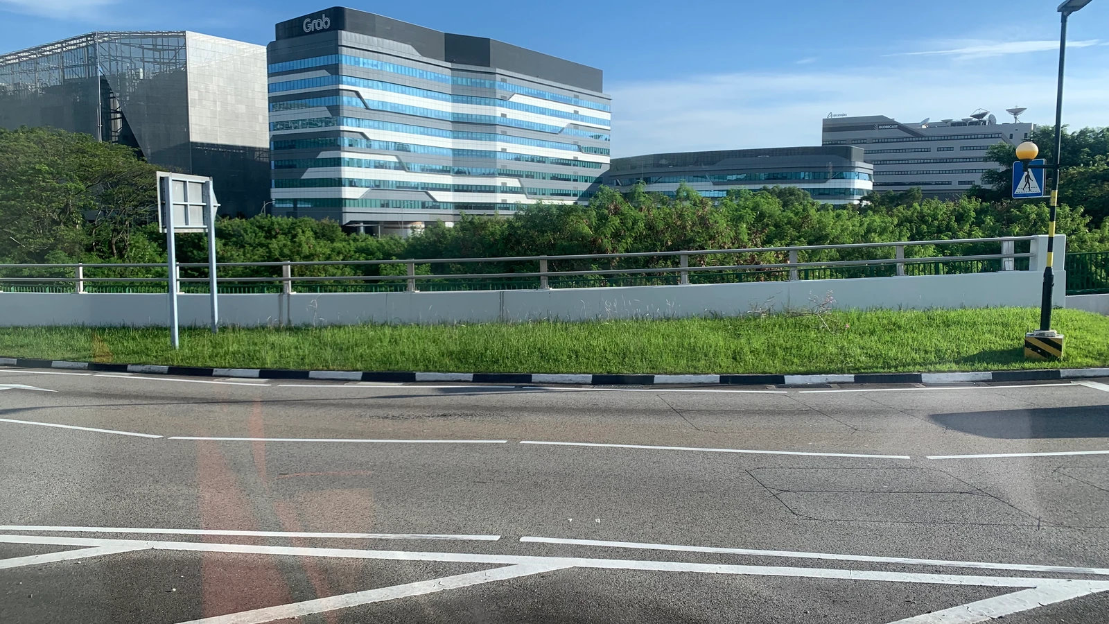 Grab's headquarters at one-north in Singapore, with no article titles or subtitle overlays.